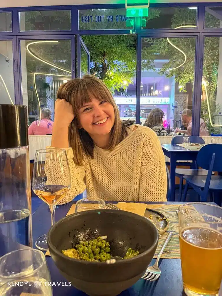 Casual dinner in Greece wearing a light sweater for cool May evenings.