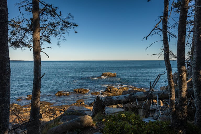 Stunning seascape from Maine's coastline, featuring rocky shores and serene ocean views.